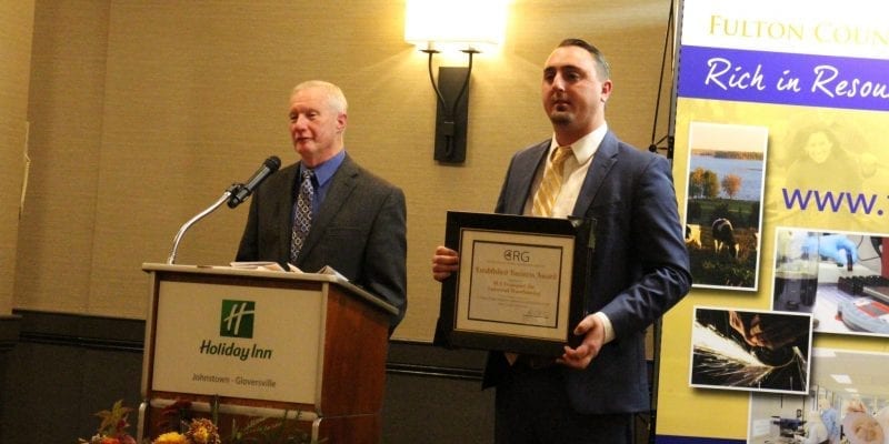 SLA Transport, Inc./Universal Warehousing, Inc. General Manager Andrew Olbrych, left, and Vice President Dave Groff are presented with the Large Established Business Award